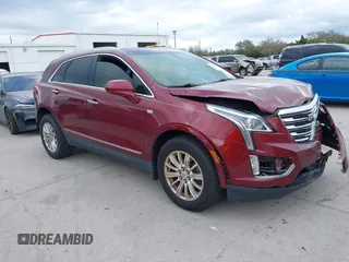 2017 Cadillac XT5 FWD with VIN 1GYKNARS2HZ107587, listed as a IAAI auction lot 41614842 with 124,611 mi miles. Bid and sale history available at carsss.com. Image 1.