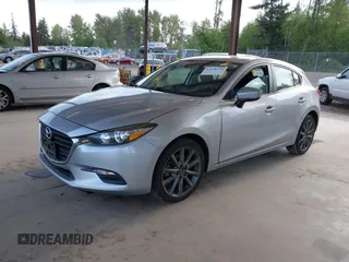 2018 Mazda 3 Touring z VIN 3MZBN1L37JM201797, wystawiony jako IAAI lot #42258756 z przebiegiem 80 593 mil mil oraz . Historia ofert i sprzedaży dostępna na DreamBid. Obrazek 17.