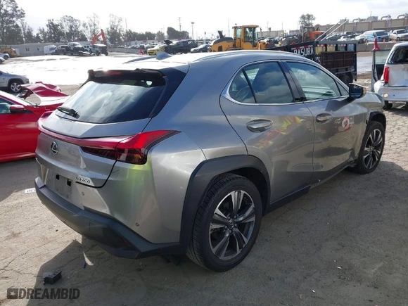 2021 Lexus UX with VIN JTHX3JBH4M2043263, listed as a IAAI auction lot 41671055 with 100,589 mi miles. Bid and sale history available at carsss.com. Image 4.
