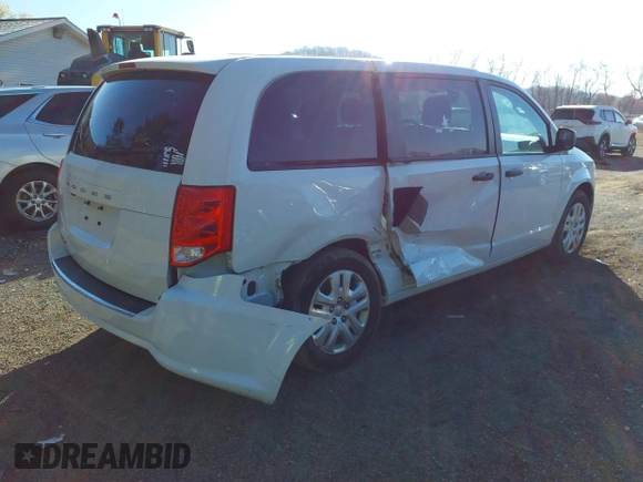 2019 Dodge Grand Caravan SE with VIN 2C4RDGBG2KR799660, listed as a IAAI auction lot 41898556 with 104,642 mi miles and . Bid and sale history available at DreamBid. Image 4.