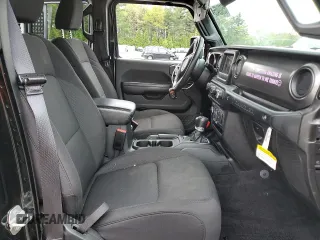 2023 Jeep Wrangler Sport S with VIN 1C4HJXDN6PW618252, listed as a Copart auction lot 55939455 with 69,681 mi miles and Salvage title. Bid and sale history available at DreamBid. Image 7.