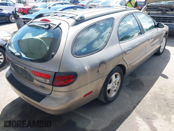 2002 Ford Taurus z VIN 1FAHP59U52G115825, wystawiony jako IAAI lot #41904552 z przebiegiem 91 004 mil mil oraz . Historia ofert i sprzedaży dostępna na DreamBid. Obrazek 4.