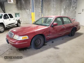 1999 Ford Crown Victoria z VIN 2FAFP73W3XX114736, wystawiony jako Copart lot #68501254 z przebiegiem 137 334 mil mil oraz Szkody całkowita. Historia ofert i sprzedaży dostępna na DreamBid. Obrazek 1.