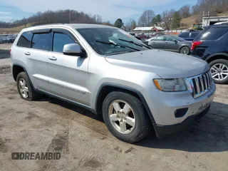 2013 Jeep Grand Cherokee Laredo with VIN 1C4RJFAG5DC634685, listed as a IAAI auction lot 41792147 with 260,594 mi miles. Bid and sale history available at carsss.com. Image 1.