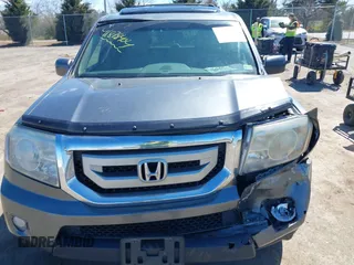 2011 Honda Pilot Touring with VIN 5FNYF4H95BB090892, listed as a IAAI auction lot 41878404 with 131,757 mi miles. Bid and sale history available at carsss.com. Image 12.