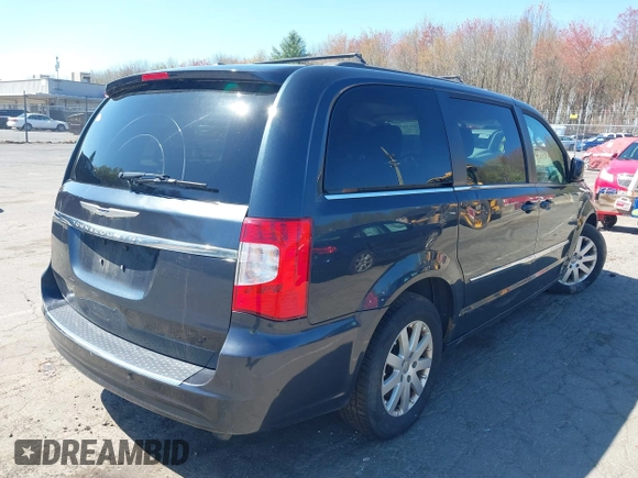 2014 Chrysler Town & Country Touring with VIN 2C4RC1BG1ER453328, listed as a IAAI auction lot 42135021 with 138,443 mi miles. Bid and sale history available at carsss.com. Image 4.