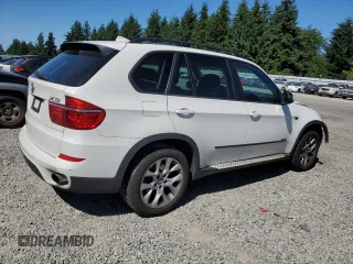 2012 BMW X5 35i with VIN 5UXZV4C5XCL987618, listed as a Copart auction lot 60308965 with 98,195 mi miles and Salvage title. Bid and sale history available at DreamBid. Image 3.