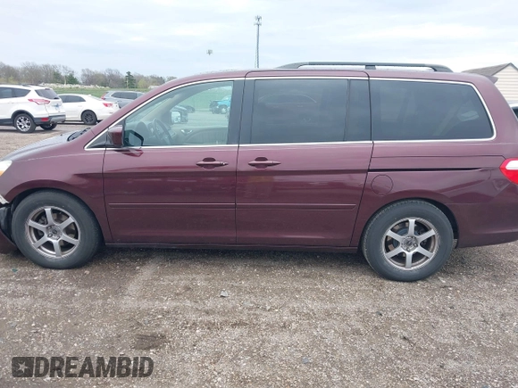 2007 Honda Odyssey Touring with VIN 5FNRL38847B048235, listed as a IAAI auction lot 41963652 with 176,412 mi miles. Bid and sale history available at carsss.com. Image 14.