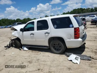 2014 Chevrolet Tahoe Commercial with VIN 1GNLC2E04ER202441, listed as a Copart auction lot 61310725 with 117,443 mi miles and Salvage title. Bid and sale history available at DreamBid. Image 2.