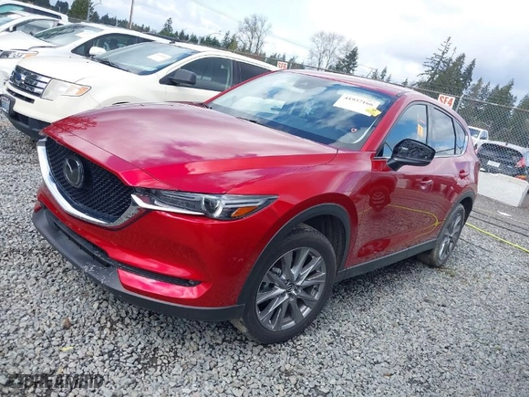 2021 Mazda CX-5 Grand Touring with VIN JM3KFBDM4M1455540, listed as a IAAI auction lot 41937166 with 1 mi miles. Bid and sale history available at carsss.com. Image 2.