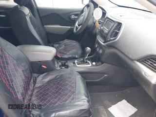 2014 Jeep Cherokee Sport with VIN 1C4PJLAB2EW279808, listed as a IAAI auction lot 42202402 with 98,671 mi miles and . Bid and sale history available at DreamBid. Image 5.