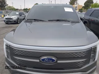 2023 Ford F-150 Lightning Pro with VIN 1FTVW1EL8PWG48559, listed as a IAAI auction lot 42033123 with 8,845 mi miles and . Bid and sale history available at DreamBid. Image 10.