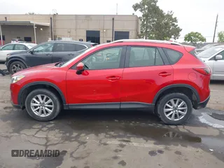 2015 Mazda CX-5 Sport z VIN JM3KE2BE9F0452625, wystawiony jako IAAI lot #42114867 z przebiegiem 167 849 mil mil oraz . Historia ofert i sprzedaży dostępna na DreamBid. Obrazek 13.