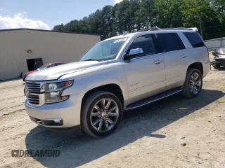 2015 Chevrolet Tahoe LTZ with VIN 1GNSKCKC4FR742540, listed as a Copart auction lot 63321555 with 128,393 mi miles and Salvage title. Bid and sale history available at DreamBid. Image 1.