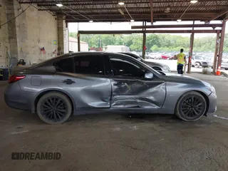 2019 Infiniti Q50 Luxe z VIN JN1EV7AR8KM594171, wystawiony jako IAAI lot #42428037 z przebiegiem 70 086 mil mil oraz . Historia ofert i sprzedaży dostępna na DreamBid. Obrazek 13.