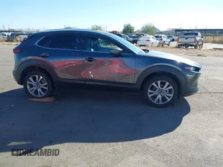 2022 Mazda CX-30 S Select z VIN 3MVDMBBL0NM415511, wystawiony jako IAAI lot #41513247 z przebiegiem Nie podano mil oraz . Historia ofert i sprzedaży dostępna na DreamBid. Obrazek 14.