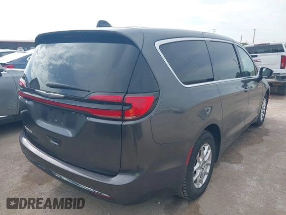 2023 Chrysler Pacifica Touring L with VIN 2C4RC1BG8PR594481, listed as a IAAI auction lot 42618839 with 60,748 mi miles and . Bid and sale history available at DreamBid. Image 4.