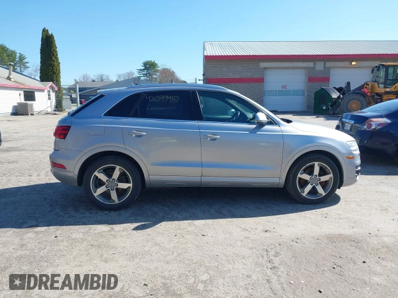 2015 Audi Q3 2.0T Premium Plus with VIN WA1EFCFSXFR010015, listed as a IAAI auction lot 42099410 with 142,117 mi miles. Bid and sale history available at carsss.com. Image 13.