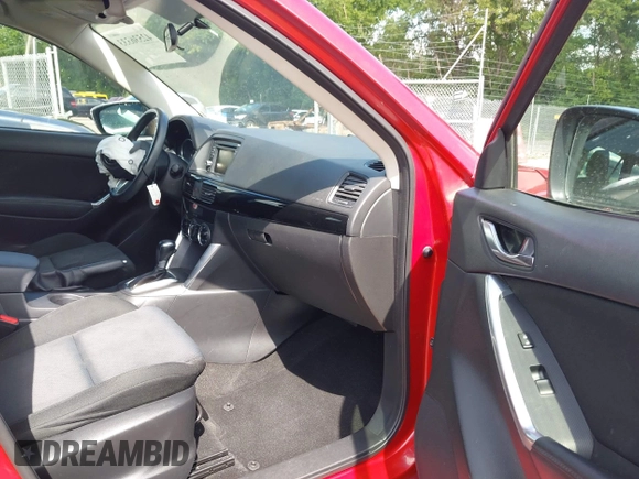 2015 Mazda CX-5 Sport with VIN JM3KE2BE8F0451014, listed as a IAAI auction lot 42536333 with 131,059 mi miles and . Bid and sale history available at DreamBid. Image 5.