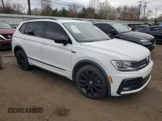 2021 Volkswagen Tiguan SE with VIN 3VV2B7AX8MM021965, listed as a Copart auction lot 53711125 with 59,554 mi miles and Salvage Title. Bid and sale history available at DreamBid. Image 4.