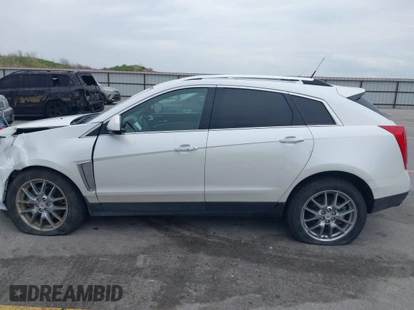 2013 Cadillac SRX Performance Collection z VIN 3GYFNHE35DS569528, wystawiony jako IAAI lot #42329652 z przebiegiem 97 184 mil mil oraz . Historia ofert i sprzedaży dostępna na DreamBid. Obrazek 14.