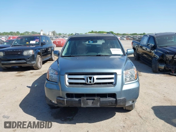 2006 Honda Pilot EX-L with VIN 2HKYF18506H521822, listed as a IAAI auction lot 42012612 with 187,946 mi miles and . Bid and sale history available at DreamBid. Image 12.