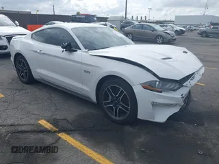 2021 Ford Mustang GT z VIN 1FA6P8CF5M5115597, wystawiony jako IAAI lot #42142619 z przebiegiem 101 687 mil mil oraz . Historia ofert i sprzedaży dostępna na DreamBid. Obrazek 1.