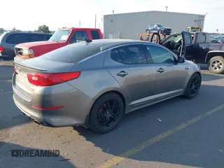 2015 Kia Optima SX Turbo with VIN 5XXGR4A61FG395148, listed as a IAAI auction lot 40313811 with 104,978 mi miles and . Bid and sale history available at DreamBid. Image 4.