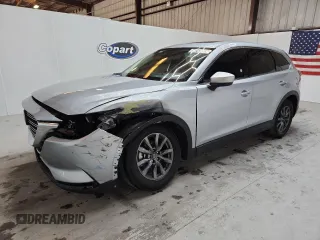 2023 Mazda CX-9 Touring с VIN JM3TCBCY9P0656636, выставлен на аукционе Copart как лот 64243905 с пробегом 59 788 миль миль и На запчасти • Non repairable. История ставок и продаж доступна на DreamBid. Изображение 1.