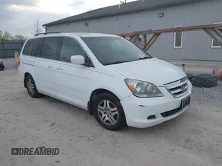 2007 Honda Odyssey EX-L with VIN 5FNRL38607B403903, listed as a IAAI auction lot 42074718 with 148,816 mi miles. Bid and sale history available at carsss.com. Image 1.