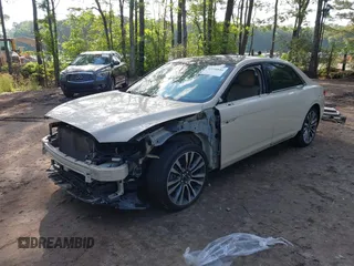 2018 Lincoln Continental Select z VIN 1LN6L9SK4J5603702, wystawiony jako IAAI lot #42198886 z przebiegiem 119 236 mil mil oraz . Historia ofert i sprzedaży dostępna na DreamBid. Obrazek 2.