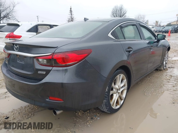 2015 Mazda 6 i Grand Touring with VIN JM1GJ1W56F1207077, listed as a IAAI auction lot 41734641 with 109,447 mi miles and . Bid and sale history available at DreamBid. Image 4.