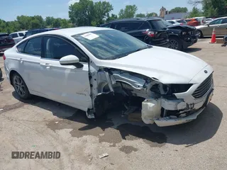 2017 Ford Fusion Hybrid SE z VIN 3FA6P0LU7HR312497, wystawiony jako IAAI lot #42680487 z przebiegiem 112 839 mil mil oraz . Historia ofert i sprzedaży dostępna na DreamBid. Obrazek 1.