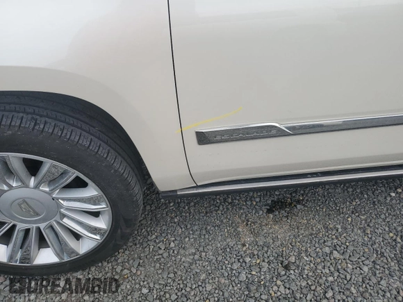 2015 Cadillac Escalade Platinum z VIN 1GYS4PKJ5FR574930, wystawiony jako Copart lot #74691204 z przebiegiem Nie podano mil oraz Szkoda całkowita • Salvage title. Historia ofert i sprzedaży dostępna na DreamBid. Obrazek 12.
