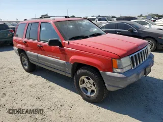1997 Jeep Grand Cherokee TSi with VIN 1J4FX58SXVC545910, listed as a Copart auction lot 73142554 with 180,896 mi miles and Salvage Title. Bid and sale history available at carsss.com. Image 4.