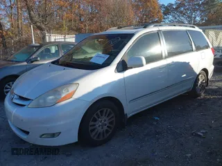 2009 Toyota Sienna XLE with VIN 5TDZK22C69S241205, listed as a IAAI auction lot 40980902 with 250,335 mi miles and . Bid and sale history available at DreamBid. Image 2.