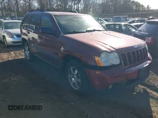 2008 Jeep Grand Cherokee Laredo with VIN 1J8GR48K28C164998, listed as a IAAI auction lot 41844702 with 999,999 mi miles. Bid and sale history available at carsss.com. Image 1.