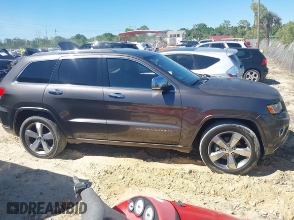 2014 Jeep Grand Cherokee Overland with VIN 1C4RJECG8EC409976, listed as a IAAI auction lot 41821685 with 186,105 mi miles. Bid and sale history available at carsss.com. Image 13.