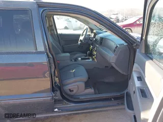 2007 Jeep Grand Cherokee Laredo with VIN 1J8GS48K97C538509, listed as a IAAI auction lot 41605236 with 164,530 mi miles. Bid and sale history available at carsss.com. Image 5.