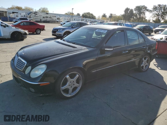 2004 Mercedes-Benz E-Class 5.0L with VIN WDBUF70J64A585084, listed as a Copart auction lot 80297124 with 233,638 mi miles and Salvage Title. Bid and sale history available at carsss.com. Image 1.