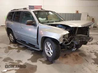 2003 GMC Envoy SLT with VIN 1GKDS13S932299354, listed as a IAAI auction lot 41238557 with 251,535 mi miles. Bid and sale history available at carsss.com. Image 1.