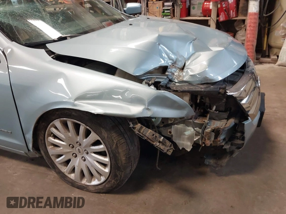2010 Ford Fusion Hybrid z VIN 3FADP0L34AR276532, wystawiony jako IAAI lot #41491883 z przebiegiem 159 076 mil mil oraz . Historia ofert i sprzedaży dostępna na DreamBid. Obrazek 6.