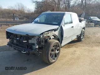 2025 Rivian R1T Adventure z VIN 7FCTGBAAXSN035740, wystawiony jako IAAI lot #41728515 z przebiegiem 3 773 mil mil oraz . Historia ofert i sprzedaży dostępna na DreamBid. Obrazek 6.