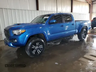 2018 Toyota Tacoma SR5 with VIN 5TFDZ5BN8JX036783, listed as a Copart auction lot 61438035 with 67,494 mi miles and Salvage title. Bid and sale history available at DreamBid. Image 1.
