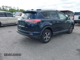 2018 Toyota RAV4 XLE with VIN JTMWFREV9JJ165655, listed as a IAAI auction lot 42138998 with 123,569 mi miles and . Bid and sale history available at carsss.com. Image 4.