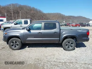 2018 Toyota Tacoma SR with VIN 5TFCZ5AN9JX123749, listed as a IAAI auction lot 41768884 with 42,852 mi miles and . Bid and sale history available at DreamBid. Image 14.