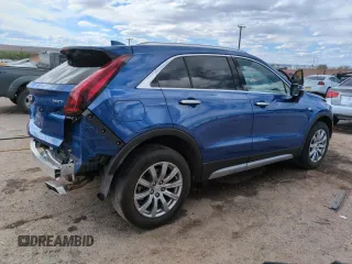 2023 Cadillac XT4 FWD Premium Luxury z VIN 1GYFZCR49PF104995, wystawiony jako Copart lot #53312695 z przebiegiem 28 647 mil mil oraz Szkody całkowita. Historia ofert i sprzedaży dostępna na DreamBid. Obrazek 3.