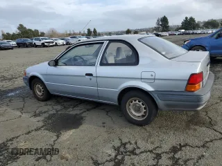 1996 Toyota Tercel DX z VIN JT2AC52L2T0137695, wystawiony jako Copart lot #86535844 z przebiegiem 246 554 mil mil oraz Czysty tytuł • Clean title. Historia ofert i sprzedaży dostępna na DreamBid. Obrazek 2.