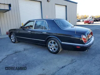 2001 Bentley Arnage with VIN SCBLC31E21CX05644, listed as a Copart auction lot 77706154 with 57,446 mi miles and Clean Title. Bid and sale history available at DreamBid. Image 2.