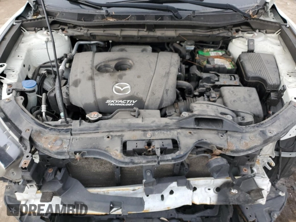 2015 Mazda CX-5 Sport z VIN JM3KE4BY2F0516574, wystawiony jako Copart lot #84100544 z przebiegiem Nie podano mil oraz Szkoda całkowita • Salvage title. Historia ofert i sprzedaży dostępna na DreamBid. Obrazek 13.
